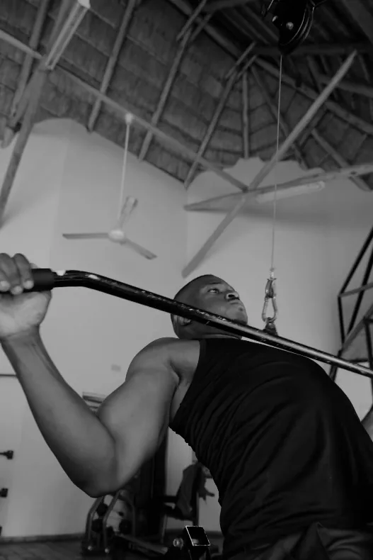 Member on the lat pulldown at Tunya Fit